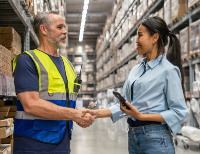 facilities manager and client shaking hands renew contract SLA